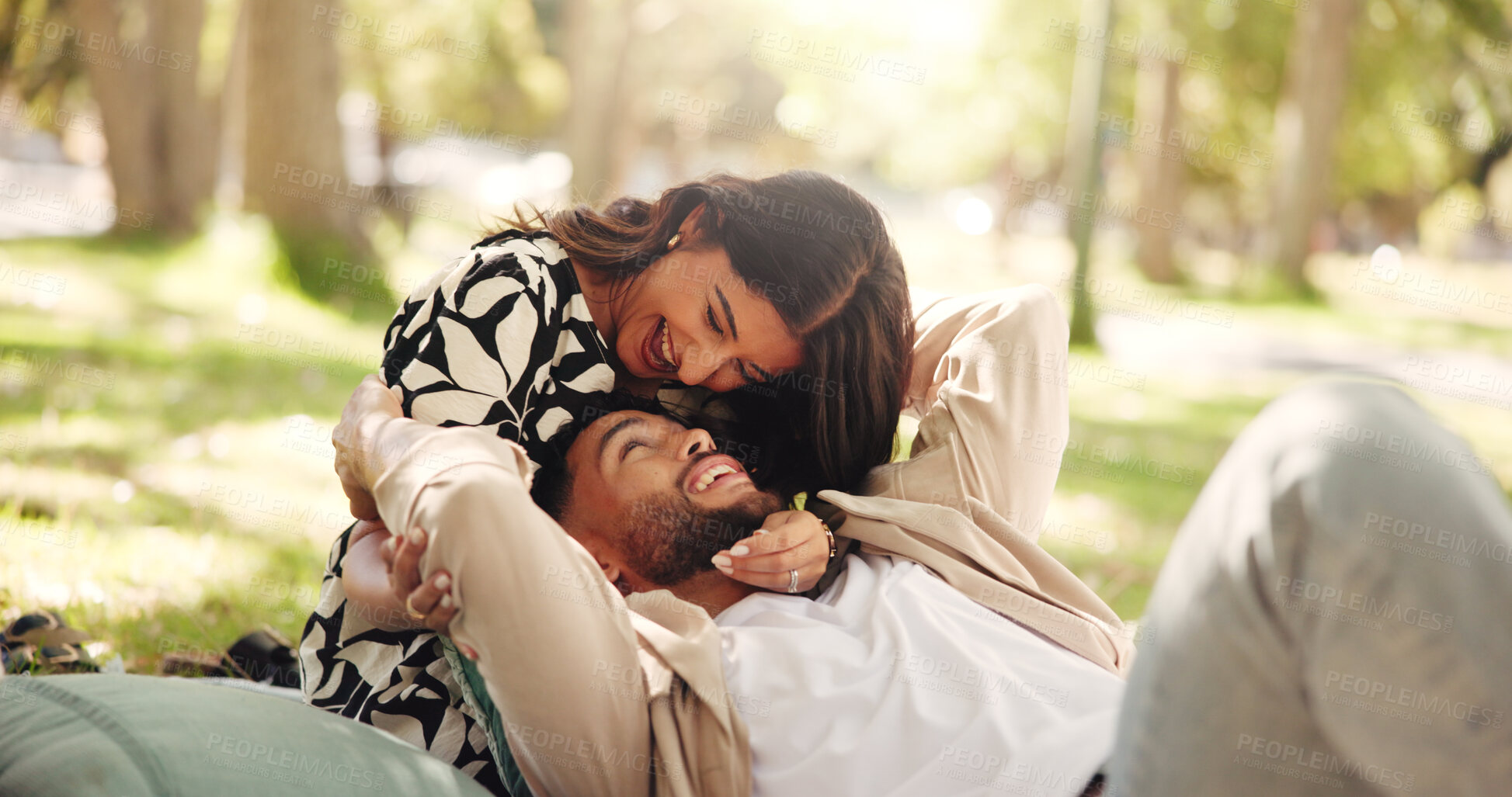 Buy stock photo Laughing, bonding and couple on date, picnic and joke for conversation in nature, smile or relationship. Embrace, man and romance with woman on anniversary, outdoor and people with commitment or park