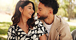 Outdoor, bonding and couple on date, picnic and joke for conversation in nature, smile or relationship. Embrace, man and romance with woman on anniversary, laughing and people with commitment or park