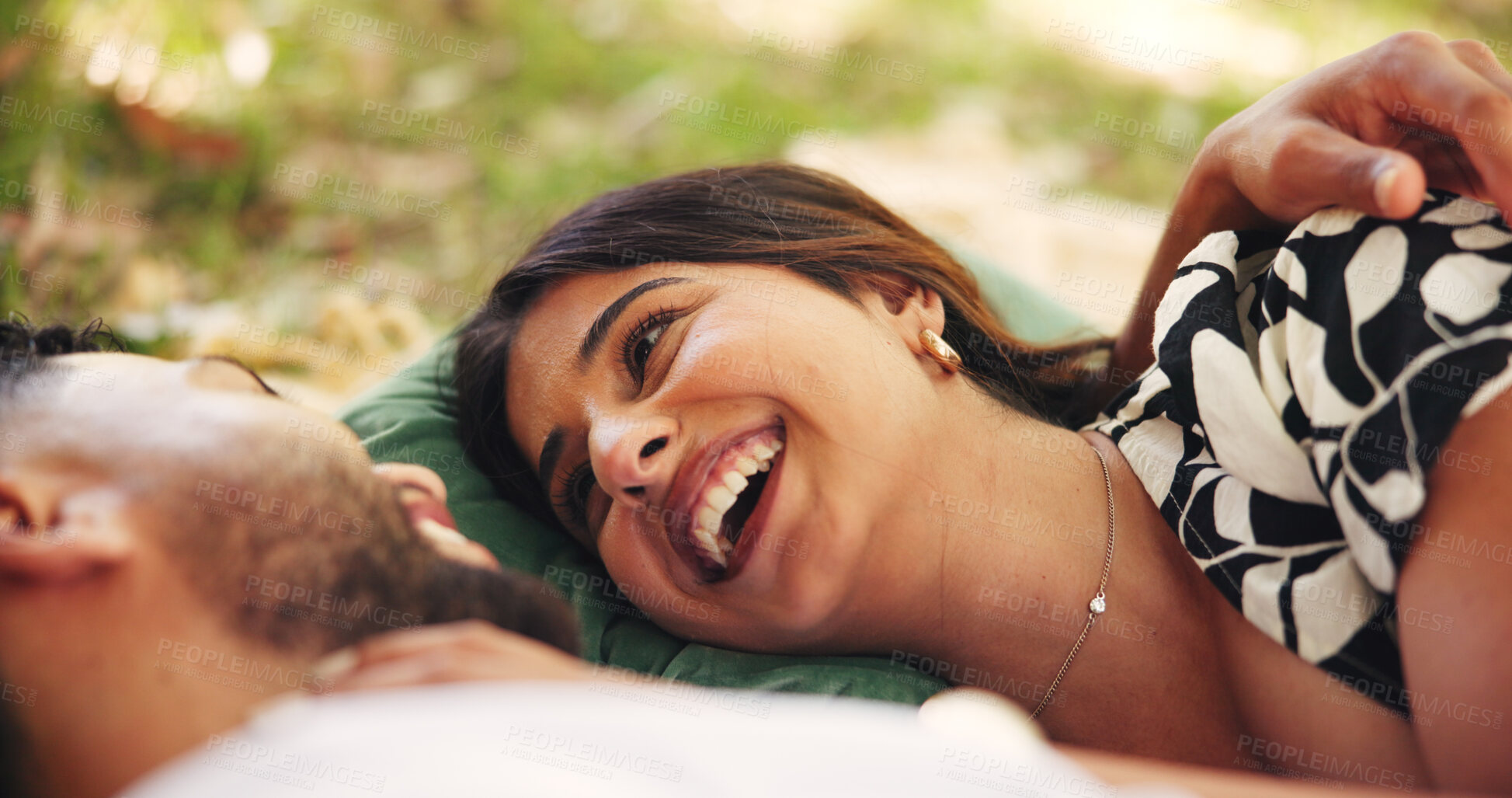 Buy stock photo Outdoor, relax and couple on date, picnic and smile for conversation in nature, embrace and relationship. Happy, man and bonding with woman on anniversary, people and together for romance or love