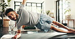 Fitness, man and side plank in home for exercise, training and stretching for balance. Core workout, muscle and strong person on floor for body strength, wellness and endurance challenge for pilates