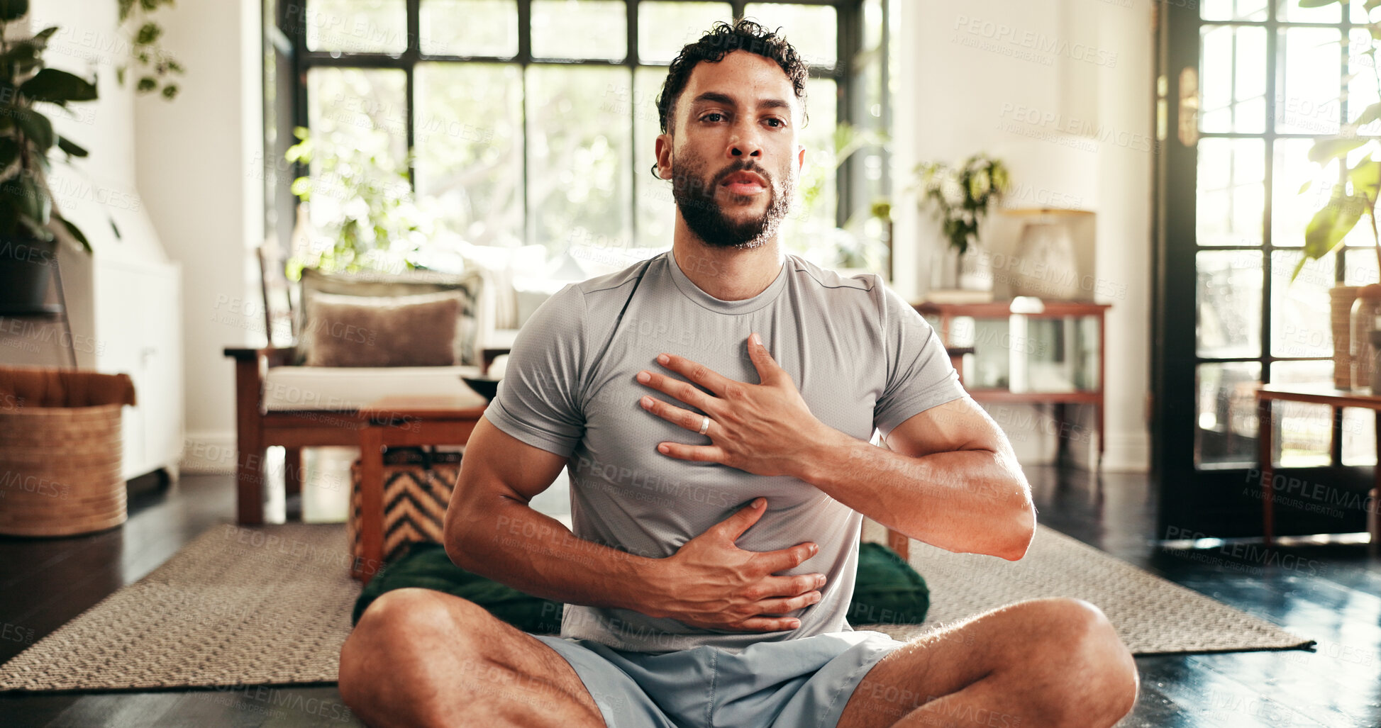 Buy stock photo Breathing, fitness and yoga with man in living room of home for health, pilates or wellness routine. Awareness, exercise and holistic with person on floor of apartment for balance or inner peace