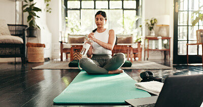 Buy stock photo Laptop, water and yoga with woman in living room of home for health, pilates or wellness routine. Computer, drinking exercise with Indian person in apartment for online fitness or holistic class