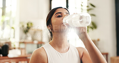 Buy stock photo Break, drinking water and exercise with woman in home for fitness, hydration or wellness workout. Bottle, relax and training with thirsty person in apartment living room for health or pilates