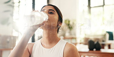 Buy stock photo Bottle, drinking water and fitness with woman in home for exercise, hydration or wellness workout. Break, relax and training with thirsty person in living room of apartment for health or pilates