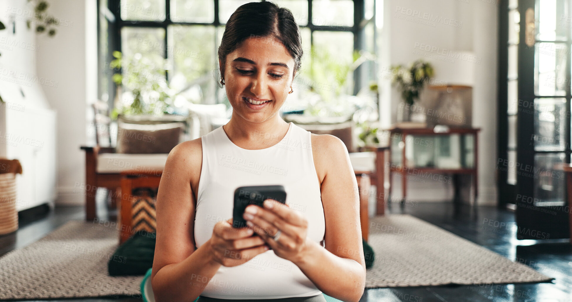 Buy stock photo Home, fitness and woman with smartphone, smile and internet with app to check progress. Person, apartment and girl in lounge, cellphone and exercise with website info for health, text or social media