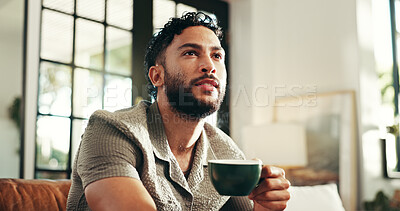 Buy stock photo Calm, thinking and coffee with man on sofa in lounge for reflection, relax and caffeine beverage. Inspiration, espresso and morning with person in living room at home for latte cup, drinking and idea