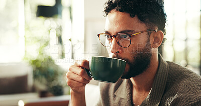 Buy stock photo Relax, glasses and coffee with man on sofa in lounge for reflection, calm and caffeine beverage. Inspiration, espresso and morning with person in living room at home for latte cup, drinking and idea