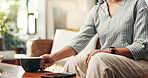Calm, hands and coffee with woman on sofa in lounge for peace, relax and caffeine beverage. Break, espresso and morning with closeup of person in living room at home for latte cup, drinking and mug