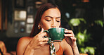Drinking, coffee and woman in cafe, relax and customer with hot beverage in morning, latte and enjoy. Break, consumer and person with cup in shop, calm and aroma of tea in store, taste or flavor