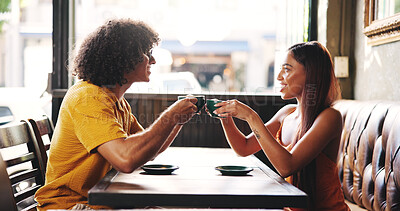 Buy stock photo Cafe, couple and coffee with cheers for date, bonding together and connection with talking. Restaurant, woman and man with happiness for tea drink, conversation and beverage toast in relationship