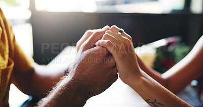 Buy stock photo Love, couple and holding hands for care, support and trust on date in restaurant. Closeup, table and comfort with people for relationship, marriage commitment and romantic connection with partner