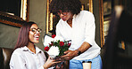 Restaurant, couple and flowers as present for date, anniversary and bonding together with happiness. Cafe, man and surprised woman with roses bouquet for celebration, romance and love in relationship