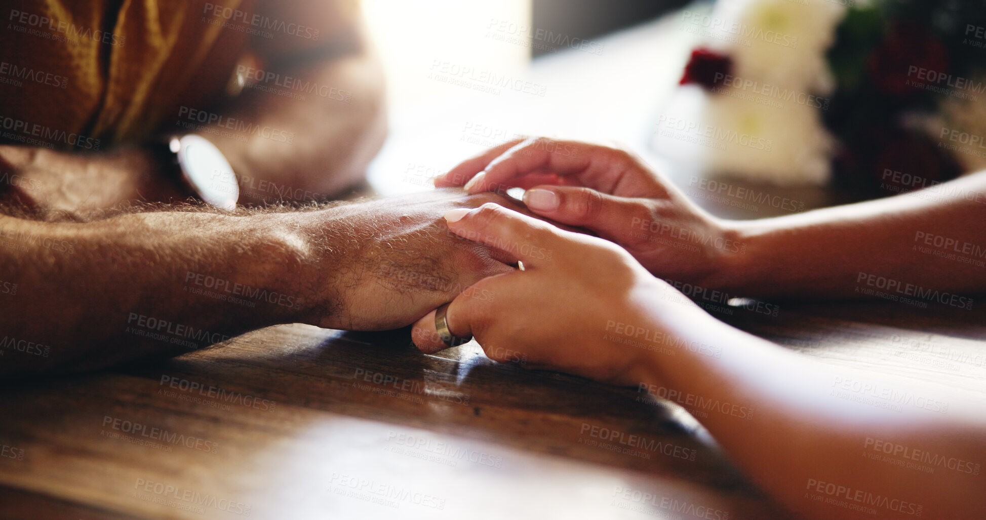 Buy stock photo Love, couple and holding hands for support, connection and care on date. Closeup, table and comfort with people for relationship, trust and romantic commitment with partner in marriage bonding