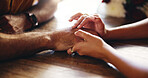 Love, couple and holding hands for care, connection and support on date in restaurant. Closeup, table and comfort with people for relationship, trust and romantic commitment with partner in marriage