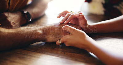 Buy stock photo Love, couple and holding hands for care, connection and support on date in restaurant. Closeup, table and comfort with people for relationship, trust and romantic commitment with partner in marriage