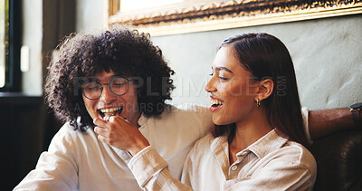 Buy stock photo Date, feeding and food with couple in coffee shop together for bonding, love or romance. Bite, happy or snack with man and woman in booth of cafe or restaurant for hospitality, relax and service