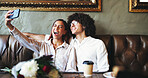 Date, love and selfie with couple in coffee shop together for bonding, memories or romance. App, profile picture or social media with man and woman in booth of cafe or restaurant for valentines day