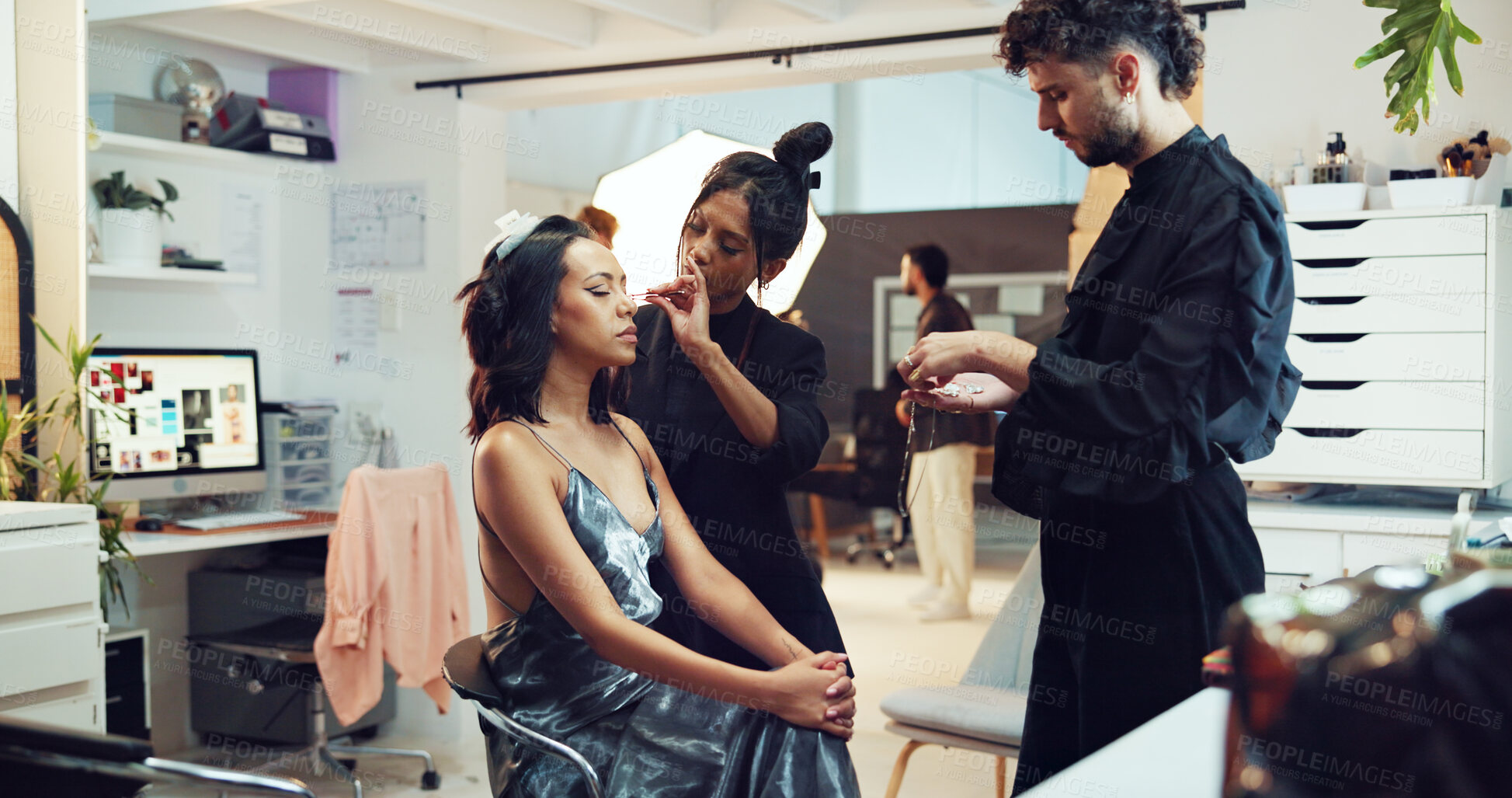 Buy stock photo Accessories, photography or styling with makeup artist and model in studio for behind the scenes preparation. Getting ready, jewelry and woman on production set for catalog or magazine photoshoot
