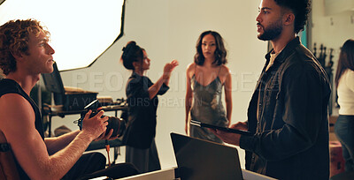 Buy stock photo Photographer, team and model with people in studio for behind the scenes, planning and production. Discussion, backstage and creative director with group on set for photoshoot, idea and magazine