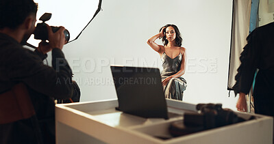Production, photographer and woman in studio, creative and pictures for fashion magazine and photoshoot. Behind the scenes, artist and group with project for media agency, camera and photography