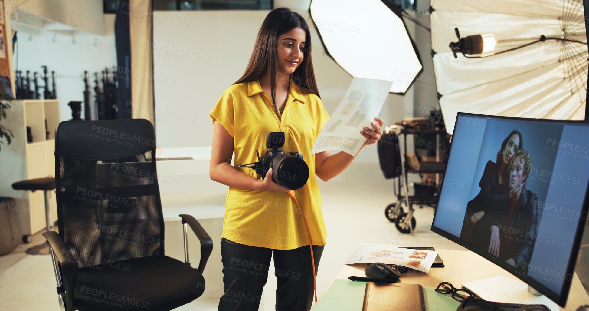 Buy stock photo Choice, photographer and woman with pictures, camera and post production in studio with documents. Photography, artist and person with photo for decision, smile and review of paperwork for magazine