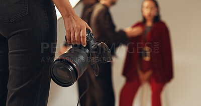 Buy stock photo Hands, photographer and people in production, camera and pictures for fashion magazine and studio. Backstage, photoshoot and group with project for media agency, creative or equipment for photography