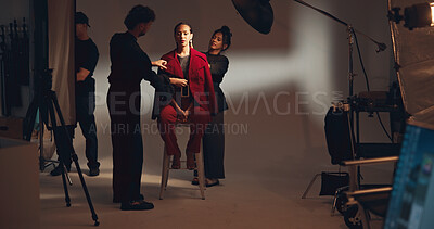 Buy stock photo People, crew and model for photoshoot in studio of media photography, getting ready and behind the scenes. Stylist, team and prepare for film production, clothes setup and catalog of fashion industry