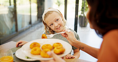 Buy stock photo Eating, food and parents with child in home for lunch, dinner and meal together for bonding. Family, happy and mother with girl at dining table to dish supper for wellness, health and nutrition