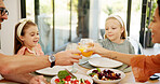 Cheers, family and girls with food, celebration and healthy meal with happiness, comfort and orange juice. Parents, father and mother with daughters, home and support with love and bonding together