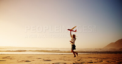 Buy stock photo Kid, beach and playing with airplane toy for flying game, sunset fun and imagination trip on island. Mockup space, girl and running at ocean with fantasy flight, holiday freedom and adventure