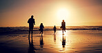 Sunset, family and running in sea water for holiday, bonding or energy with back outdoor. Race, mother and father with kids at beach with space, travel or play game with parents on summer adventure