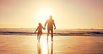Ocean, sunset and father with girl, holding hands and travel with journey, bonding together and water. Nature, seaside and family with parent, daughter and dad with summer holiday, beach and vacation