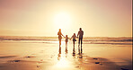 Sunset, family and holding hands at sea for holiday, walking and bonding together outdoor. Back, mother and father with children at ocean with mockup space, travel or summer adventure with parents