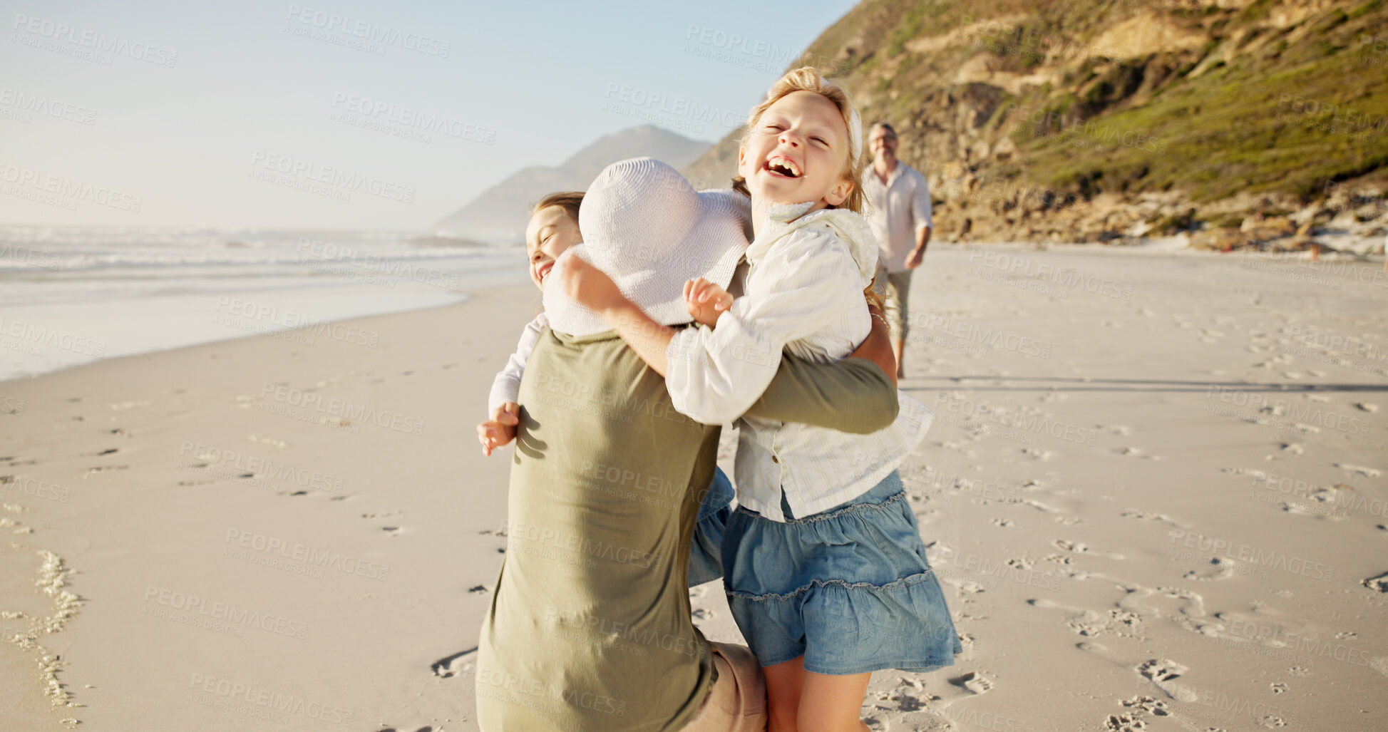 Buy stock photo Children, smile and hug mom at beach with father, excited or bonding with love on vacation in summer. People, parents and kids on holiday, family and playful with embrace, care or happy by sea