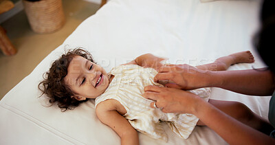Buy stock photo Girl, toddler and hands of mother for tickles in bedroom of home for bonding or development. Family, fun or happy with child and parent on bed in apartment for safety, security or trust from above