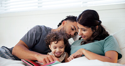 Buy stock photo Reading, book and parents with toddler in bed at home together for bonding in morning on weekend. Happy, love and girl baby relaxing with mother and father for storytelling in bedroom at house.
