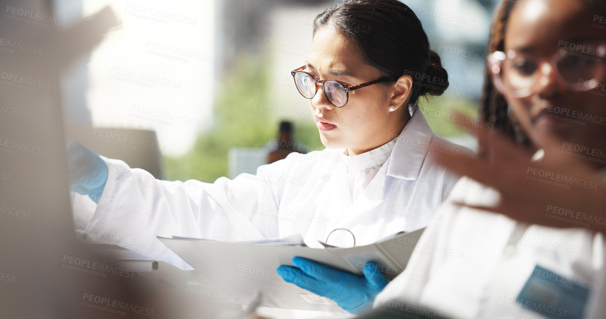 Buy stock photo Healthcare, scientists and women with document, lab and info for treatment of disease or cure. Medical research, reading and collaboration for project in clinic, pharmaceutical and people with notes