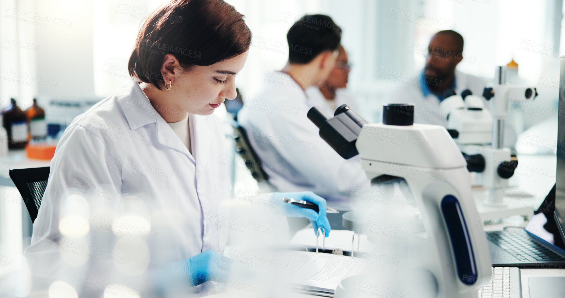 Buy stock photo Woman, scientist and reading document in lab of medical study, experiment results and information. Person, microscope and paperwork of healthcare report, biotech and investigation feedback of vaccine