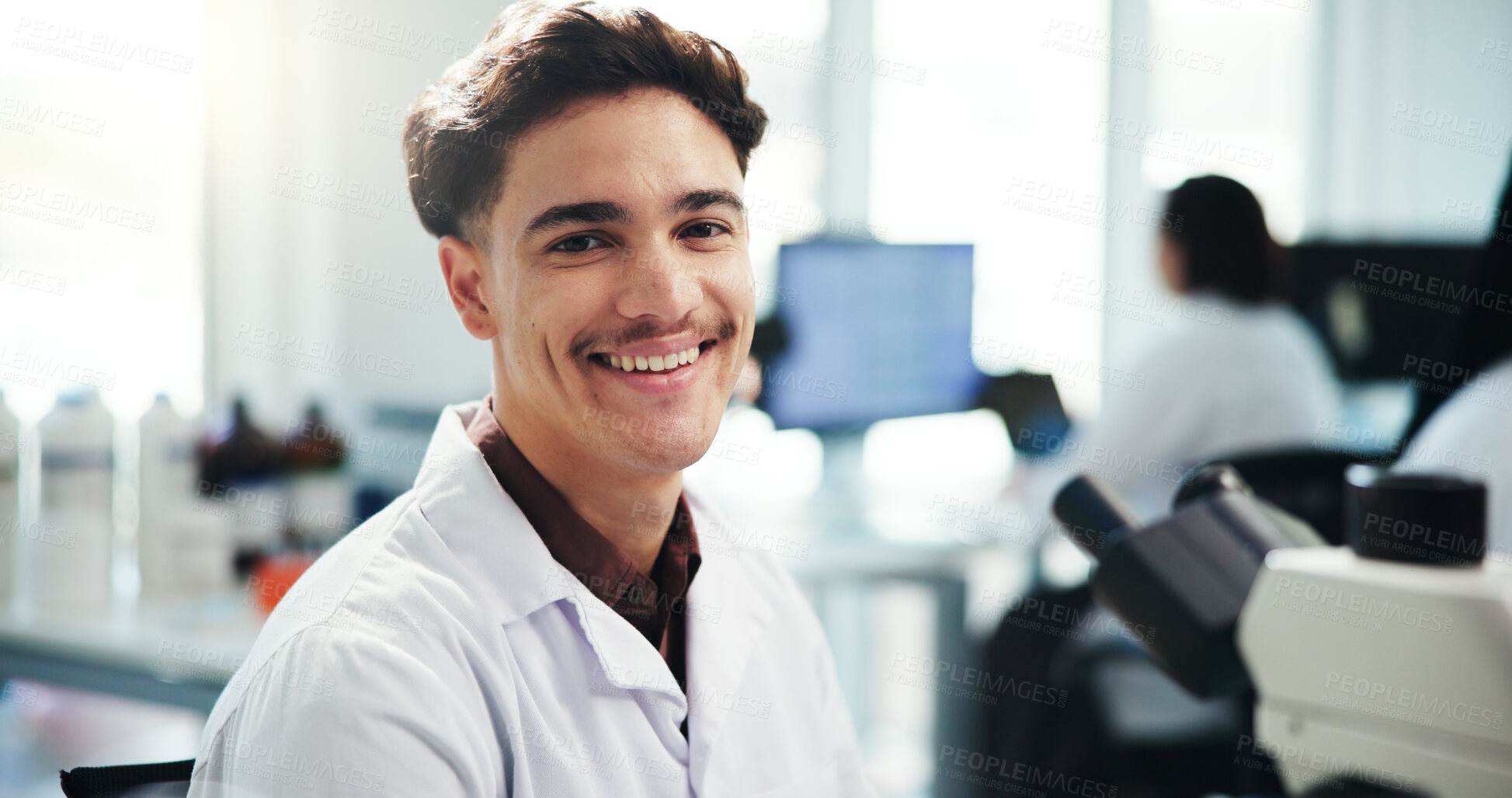 Buy stock photo Portrait, man and scientist with microscope in lab for medical research, experiment and about us. Smile, male person and biotechnology industry, study virus and sample testing for vaccine development