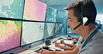 Computer, screen and man with headset in control room for storm tracking, satellite forecast or writing weather pattern. Meteorology, person and radar display for atmosphere monitor or cyclone data