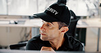 Security guard, serious and man with computer, surveillance or thinking for safety in control room. Digital, online and person with tech for footage, private service or video for protection in office