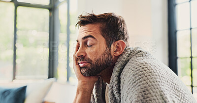 Buy stock photo Man, tired and sick with blanket on sofa, eyes closed or fever with fatigue, exhausted or headache in lounge. Person, burnout and rest on couch, sleep or migraine with flu in living room at apartment