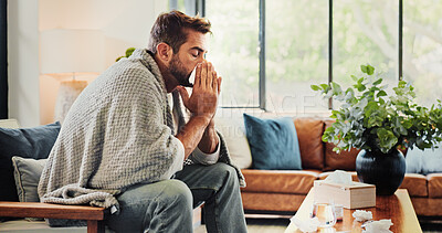 Buy stock photo Sick, man and blowing nose with blanket in home for flu symptoms, fever and respiratory disease on sofa. Illness, person and virus infection in living room with sneezing, medical condition or allergy
