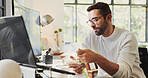 Eating, online and man with computer, home and review of graphs for report, remote work or data analyst. Screen, financial coordinator and person with food in morning, breakfast or research with tech