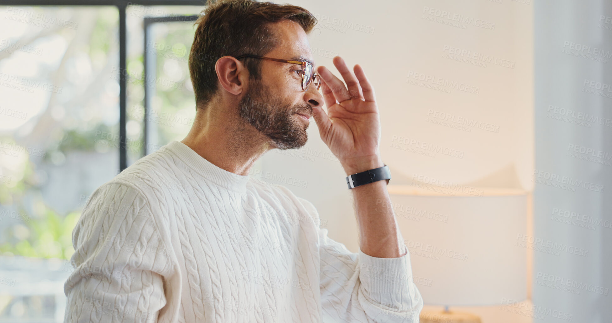 Buy stock photo Home, thinking and man in lounge, glasses and smile with optometry, clear vision or thoughtful. Person, apartment or guy in living room, gratitude for eyewear or pride with confidence, space or sight