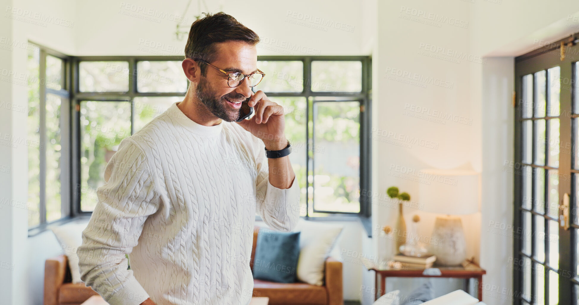 Buy stock photo Home, phone call and man in lounge, conversation and communication with connection. Apartment, person and guy with smartphone, mobile user and happiness with network, chatting or smile in living room