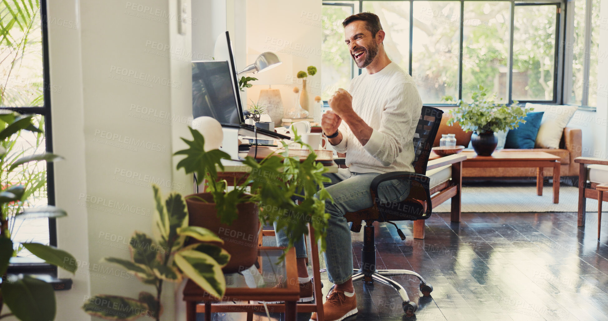 Buy stock photo Man, remote work and happy at computer with fist pump, good news and positive feedback for article. Creative writer, tech and excited in home for publishing approval, story opportunity or achievement