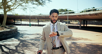 Buy stock photo Outdoor, businessman and hurry with clock for time, morning commute and late for justice meeting. Travel, male lawyer and check with watch for case schedule, urgent deadline and walking to workplace
