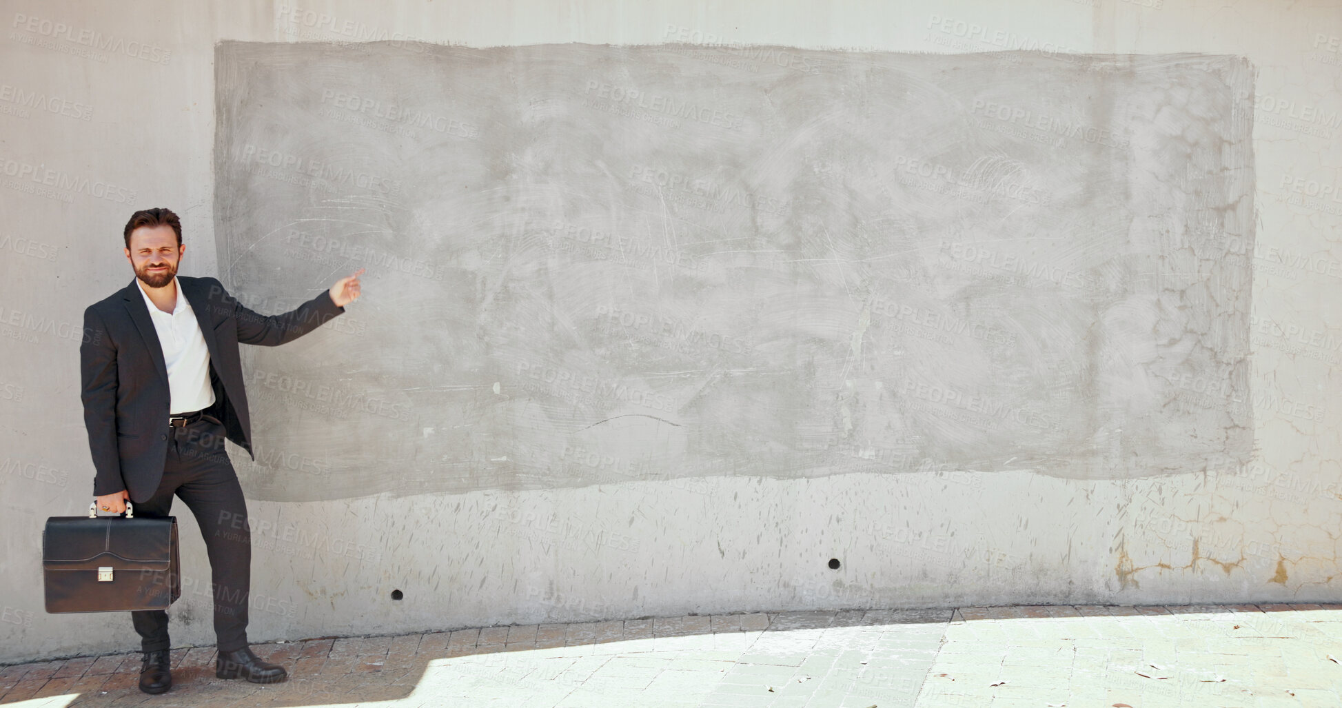Buy stock photo Portrait, man and pointing to brick wall in city of advertising, announcement and interview direction. Person, mockup space and show for corporate recruitment, hiring information and onboarding offer