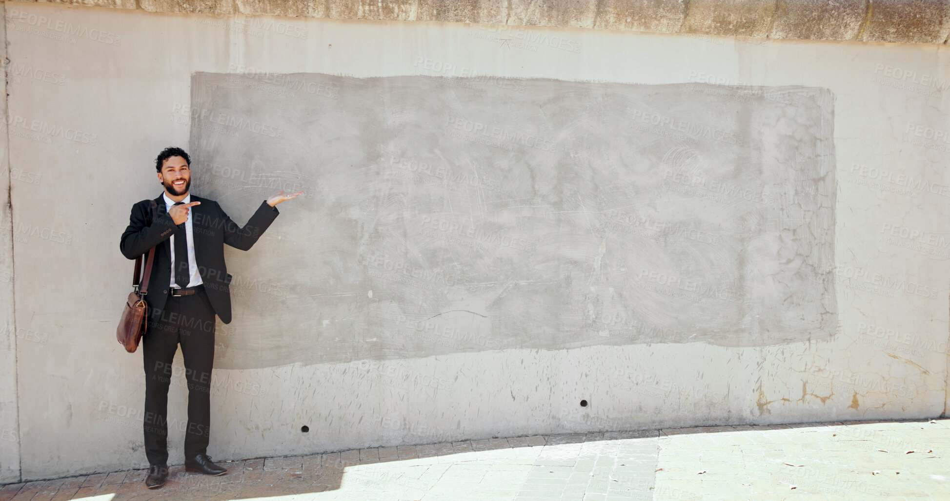 Buy stock photo Portrait, man and show direction to brick wall in city of advertising, announcement and interview. Person, mockup space and pointing for corporate recruitment, hiring information and onboarding offer